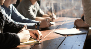 Group of people sitting at a desk