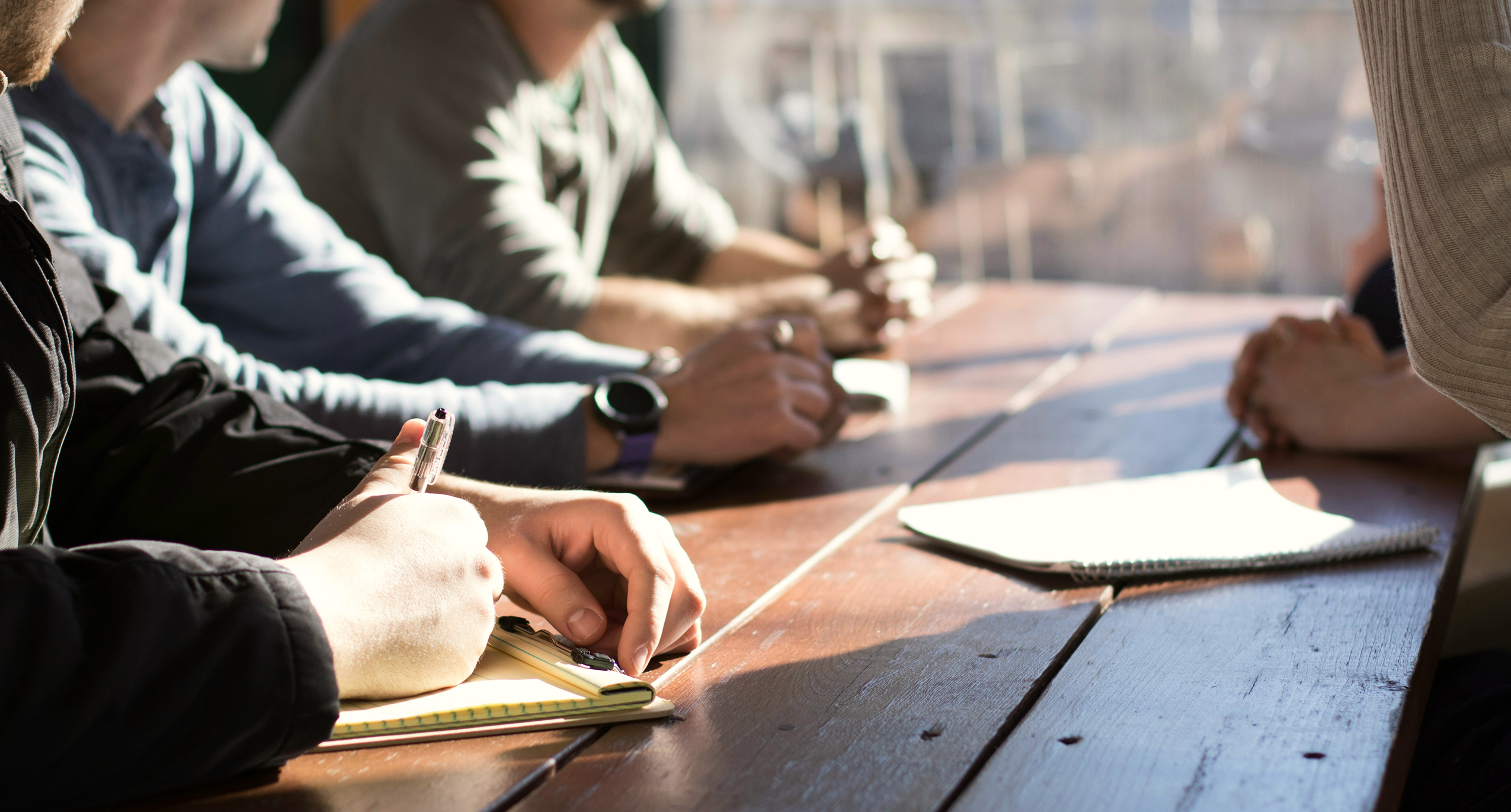 Group of people sitting at a desk